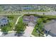 An aerial view of a home showcasing its well-maintained lawn and landscaping in a Gathering-friendly neighborhood at 11904 Greenchop Pl, Riverview, FL 33579