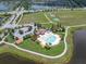 Aerial view of community pool, amenities, and neighborhood, showcasing the convenient location at 11904 Greenchop Pl, Riverview, FL 33579