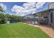 Lush backyard with patio, dining area and screened-in lanai offering both sunny and shaded spots at 11904 Greenchop Pl, Riverview, FL 33579
