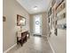 A bright and welcoming foyer features neutral walls and tile flooring, creating a warm entryway at 11904 Greenchop Pl, Riverview, FL 33579