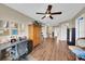 Open area with hardwood flooring, built-in storage, and stairs leading to another level at 11904 Greenchop Pl, Riverview, FL 33579