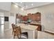 Bright eat-in kitchen featuring an island with seating, stainless steel appliances, and granite countertops at 11904 Greenchop Pl, Riverview, FL 33579