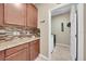 Functional laundry room boasts ample cabinet space, decorative backsplash, and convenient access to washer and dryer at 11904 Greenchop Pl, Riverview, FL 33579