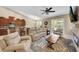Open-concept living space with a kitchen and adjacent dining area filled with natural light and comfortable seating at 11904 Greenchop Pl, Riverview, FL 33579