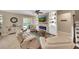 Spacious living room with a stone fireplace, plush seating, and seamless access to the outdoor pool area at 11904 Greenchop Pl, Riverview, FL 33579