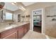 Bright and spacious bathroom featuring double sinks and access to the shower and main bedroom at 11904 Greenchop Pl, Riverview, FL 33579