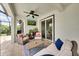Relaxing screened patio area features an outdoor television, seating area, and access to the pool at 11904 Greenchop Pl, Riverview, FL 33579