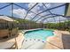 Sparkling pool surrounded by lush landscaping and patio area for relaxing at 11904 Greenchop Pl, Riverview, FL 33579