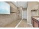 Walk-in shower with clear glass and tile surround, creating a spa-like experience at 11904 Greenchop Pl, Riverview, FL 33579