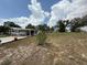 Spacious grassy backyard perfect for outdoor activities and relaxation on a sunny day at 12021 Club House Rd, Brooksville, FL 34613