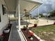 Extended carport area providing ample space for parking with manicured garden beds at 12021 Club House Rd, Brooksville, FL 34613
