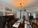 Bright and airy dining room features ample seating and tasteful decorations at 12021 Club House Rd, Brooksville, FL 34613