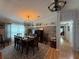 Well-lit dining room with stylish decor, a long table, and cozy ambiance at 12021 Club House Rd, Brooksville, FL 34613