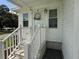 Inviting front porch with stairs and decorative door, perfect for a warm welcome at 12021 Club House Rd, Brooksville, FL 34613