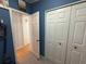 Hallway with an open view to the laundry room and other areas of the house at 12021 Club House Rd, Brooksville, FL 34613