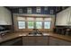 Stylish kitchen features stainless steel appliances, bay window, and ample counter space at 12021 Club House Rd, Brooksville, FL 34613