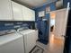 Spacious laundry room with practical amenities and stylish decor at 12021 Club House Rd, Brooksville, FL 34613