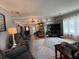 Spacious living room featuring plush seating, modern decor, and an entertainment center at 12021 Club House Rd, Brooksville, FL 34613