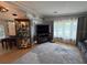 Inviting living room with wood floors, ample natural light, and comfortable seating at 12021 Club House Rd, Brooksville, FL 34613