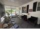 Spacious screened porch with ample seating and views, perfect for outdoor relaxation at 12021 Club House Rd, Brooksville, FL 34613