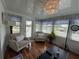 Bright sunroom with comfortable seating, large windows, and a relaxing atmosphere at 12021 Club House Rd, Brooksville, FL 34613