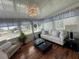 Bright and airy sunroom with natural light, comfortable seating, and serene decor at 12021 Club House Rd, Brooksville, FL 34613