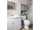 Clean bathroom featuring a white vanity, mirror, and toilet with storage at 1205 Desert Hills Dr, Sun City Center, FL 33573