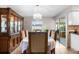 Dining area with elegant table, large china cabinet, and sliding glass doors at 1205 Desert Hills Dr, Sun City Center, FL 33573