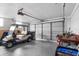 Spacious garage with a golf cart offering ample storage and parking space at 1205 Desert Hills Dr, Sun City Center, FL 33573
