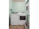 Functional laundry room with washer and dryer, offering convenience and efficiency at 1205 Desert Hills Dr, Sun City Center, FL 33573