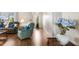 Inviting living area featuring stylish wood flooring and neutral walls at 1205 Desert Hills Dr, Sun City Center, FL 33573