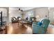 Cozy living room with wood flooring, ceiling fan and comfortable seating at 1205 Desert Hills Dr, Sun City Center, FL 33573