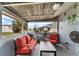 Cozy screened-in patio with comfortable seating, perfect for relaxing and enjoying the outdoors at 1205 Desert Hills Dr, Sun City Center, FL 33573