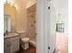 Bathroom includes white vanity with marble countertop and tiled stand-up shower at 13608 Lytton Way, Tampa, FL 33624