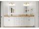 Bright bathroom featuring double vanity sinks, and tiled floors at 13608 Lytton Way, Tampa, FL 33624