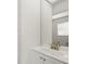 Bathroom showcasing a white vanity with modern fixtures and a large mirror at 13608 Lytton Way, Tampa, FL 33624
