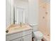 Bright bathroom with marble countertop, vanity and tiled stand-up shower at 13608 Lytton Way, Tampa, FL 33624