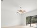 Bedroom with tile floors, ceiling fan and sliding glass doors to the lanai at 13608 Lytton Way, Tampa, FL 33624