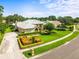 Well-manicured lawn and lush landscaping surround this beautiful single-Gathering home at 13608 Lytton Way, Tampa, FL 33624