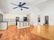 Open kitchen features white cabinets, black appliances, central island and breakfast area at 13608 Lytton Way, Tampa, FL 33624