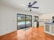 Kitchen with tile floors and large window showcasing the outdoor swimming pool at 13608 Lytton Way, Tampa, FL 33624