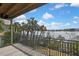 Great outdoor view of water, palm trees, and blue skies from the balcony at 1402 Harbour Walk Rd, Tampa, FL 33602