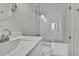 Modern bathroom featuring sleek vanity, toilet, and glass-enclosed shower with white tile at 1402 Harbour Walk Rd, Tampa, FL 33602