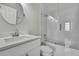 Modern bathroom featuring sleek vanity, toilet, and glass-enclosed shower with white tile at 1402 Harbour Walk Rd, Tampa, FL 33602