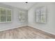 Bright bedroom with three windows and hardwood floors at 1402 Harbour Walk Rd, Tampa, FL 33602