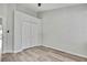 Bedroom with hardwood floors, closet, and stairway access at 1402 Harbour Walk Rd, Tampa, FL 33602