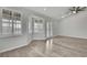 Bedroom featuring plantation shutters, hardwood floors, and french doors at 1402 Harbour Walk Rd, Tampa, FL 33602