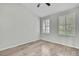 Bright bedroom featuring hardwood floors and plantation shutters on the windows at 1402 Harbour Walk Rd, Tampa, FL 33602