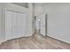 Bright bedroom features wood-look floors, closet and door to bathroom at 1402 Harbour Walk Rd, Tampa, FL 33602