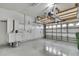 Spacious garage with epoxy floor, storage cabinets, overhead storage at 1402 Harbour Walk Rd, Tampa, FL 33602